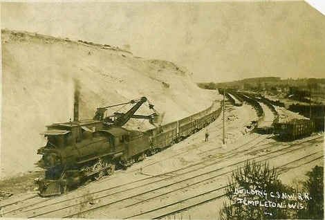 Historic steam shovel loading railroad cars at Templeton, now part of Sussex, Wisconsin